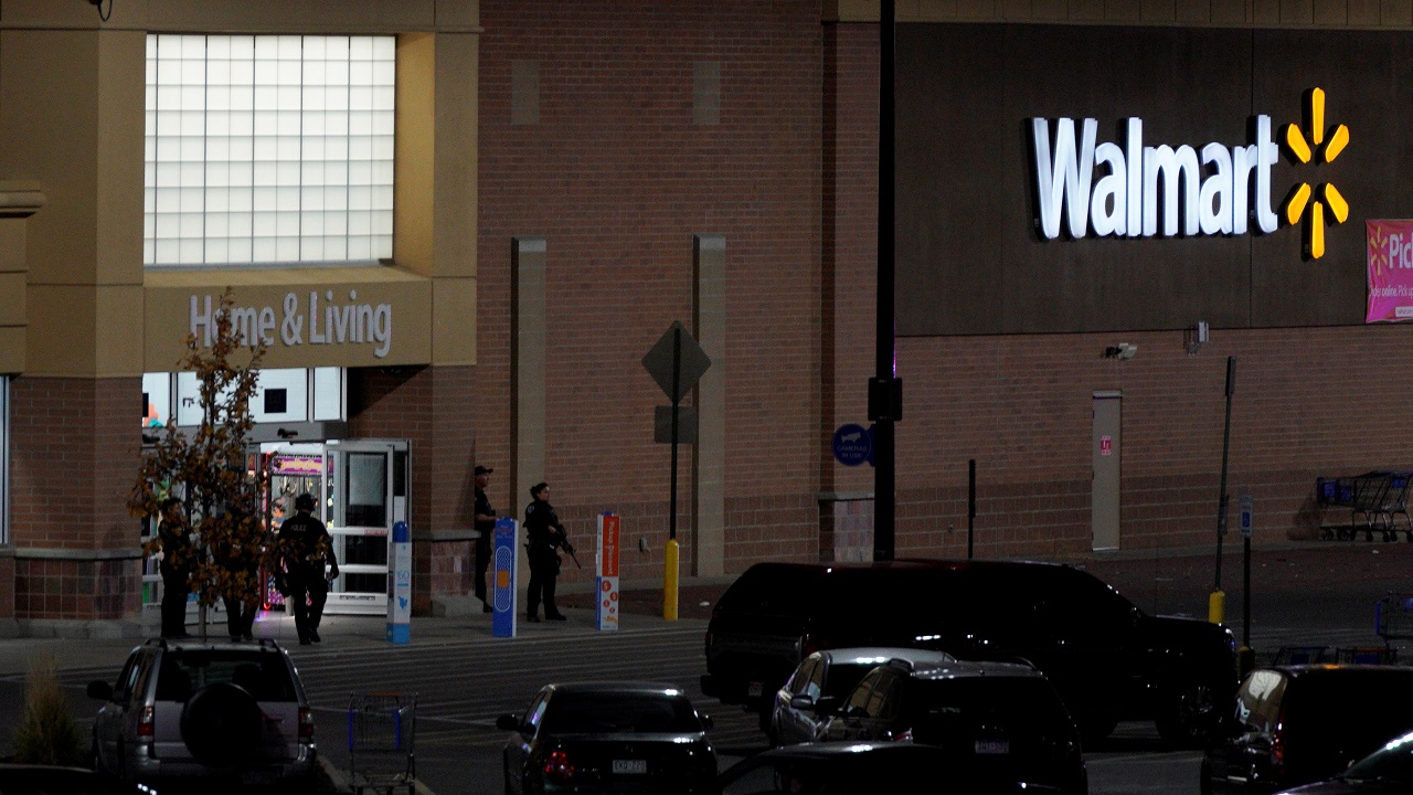   Police guard the entrance at the scene of a shooting at a Walmart in Thornton  