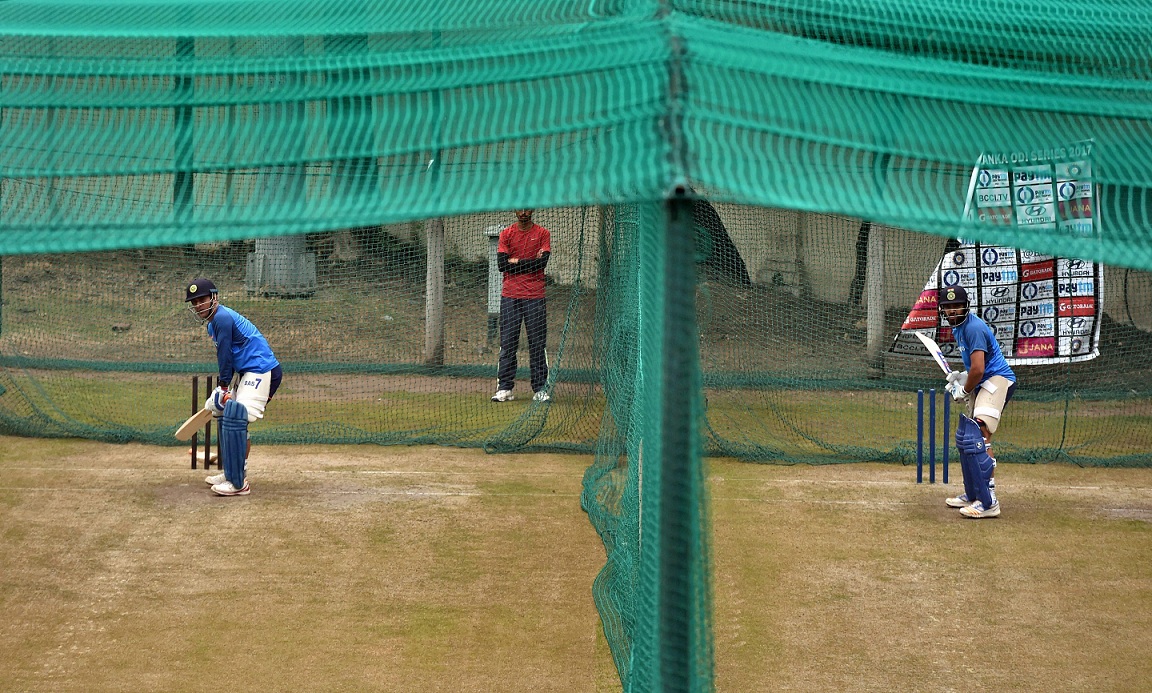   Mohali:  India's captain Rohit Sharma and Mahendra Singh Dhoni (L) bats at the nets during a practice session on the eve of the second ODI cricket match against Sri Lanka in Mohali on Tuesday. PTI 