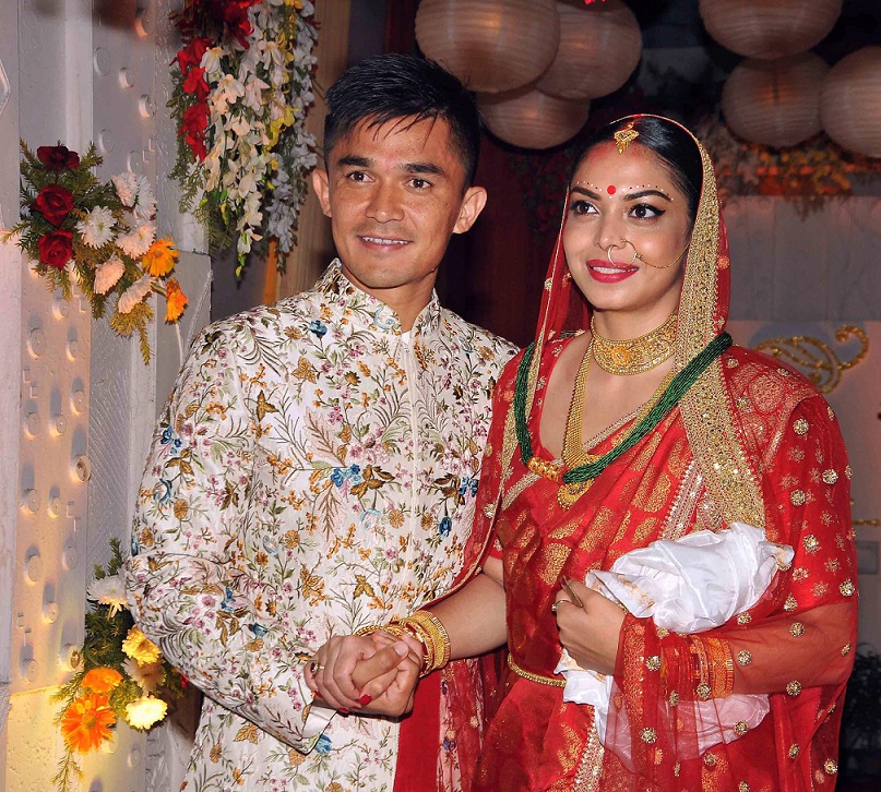   Kolkata:  Indian football captain Sunil Chhetri with his wife Sonam posing after their wedding at Ordnance Club in Kolkata on Monday late evening. PTI 