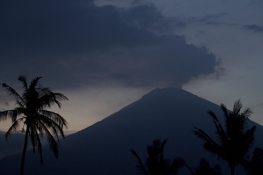   China suspends flights from Bali to China due to volcanic ash  

 China’s aviation authority has suspended all flights from the Indonesian holiday island of Bali to Chinese cities until the threat of volcanic ash clears, the state-run People’s Daily newspaper reported on Monday. Clouds of volcanic ash from Bali’s erupting Mount Agung volcano disrupted flights to and from the island’s airport last week, stranding many thousands of tourists. 

 Flights began resuming when the airport reopened on Wednesday, after the wind changed and blew the ash away from flight paths. Individual airlines make their own decisions on whether to operate. Australia’s Jetstar resumed flights on Monday, while Virgin Australia Holdings said it planned to do so on Tuesday. 

   Karangasem:  Mount Agung volcano is seen in Karangasem, Bali, on Monday. Indonesia's disaster mitigation agency said Monday the volcano remains at its highest alert level but most of Bali is safe for tourists. AP  