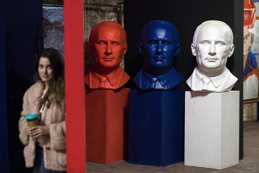   Moscow:  A museum worker passes sculptures of Russian president Vladimir Putin of Russian president Vladimir Putin, part of the "SUPERPUTIN" exhibition at the UMAM museum in Moscow on Thursday. The 65-year old Russian leader, who has ruled the country since 2000, announced on Wednesday that he would seek his fourth term in office in March. Putin's 80% approval ratings make his victory all but certain. AP 