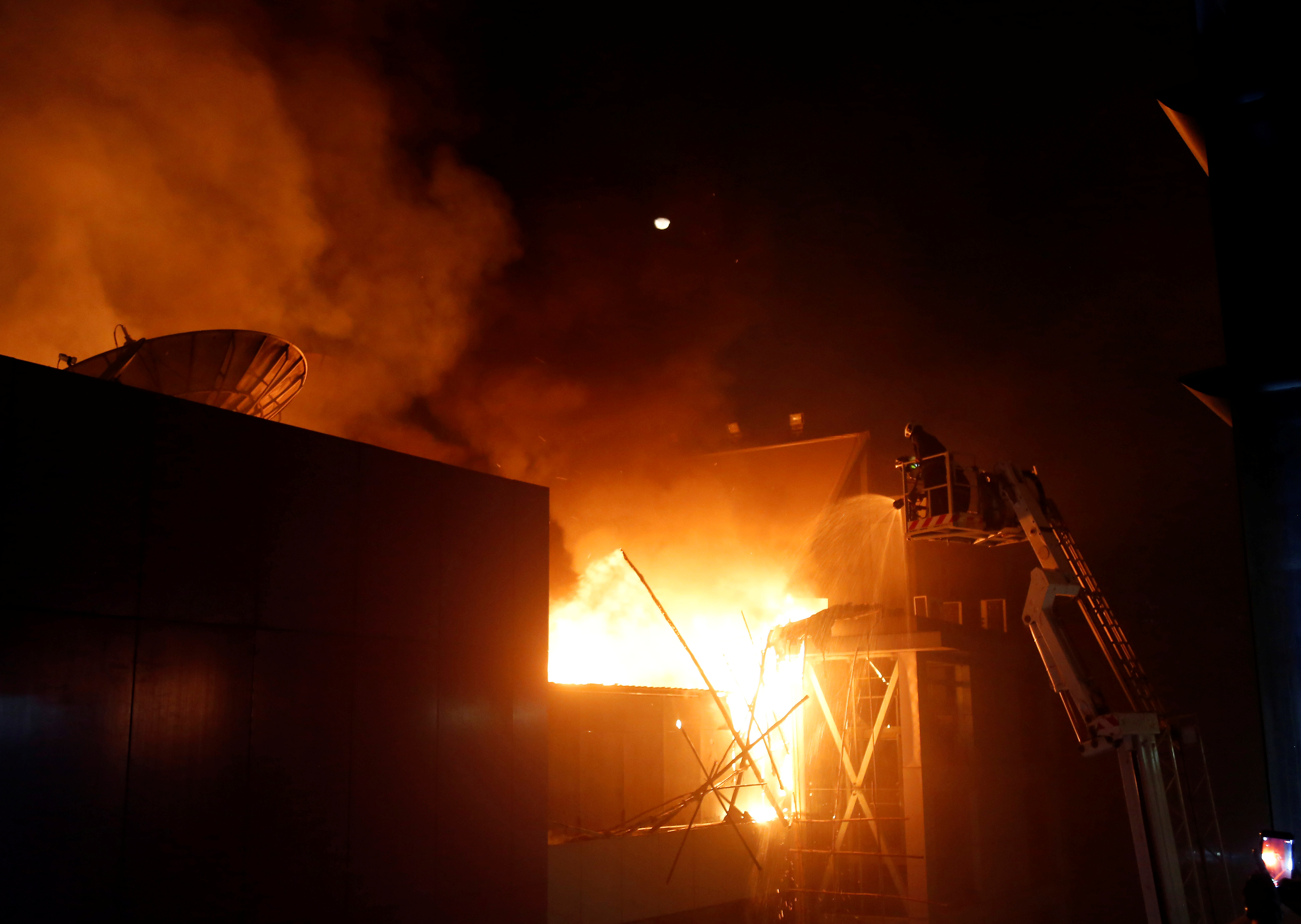   A visual from last night:  
Firefighters try to extinguish a fire at a restaurant in Mumbai. (Picture Courtesy: Reuters) 
  