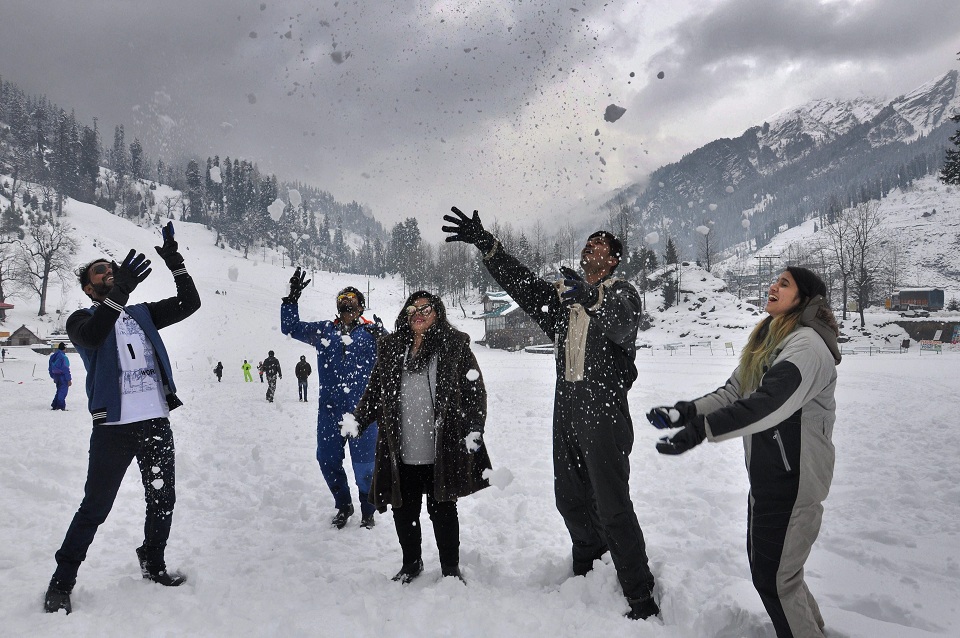   Manali:  Tourists enjoying with snow after a fresh snowfall in Manali on Tuesday. PTI 