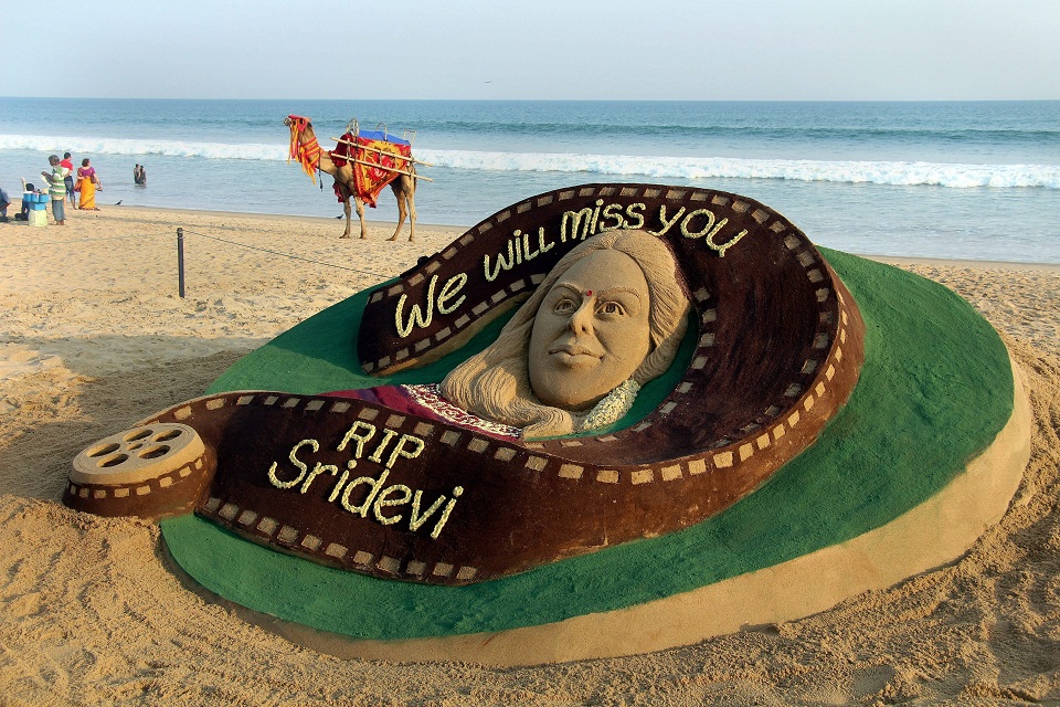   Sand artist Sudarsan Pattnaik pays tribute to actor Sridevi through his sand sculpture at Puri beach. PTI   