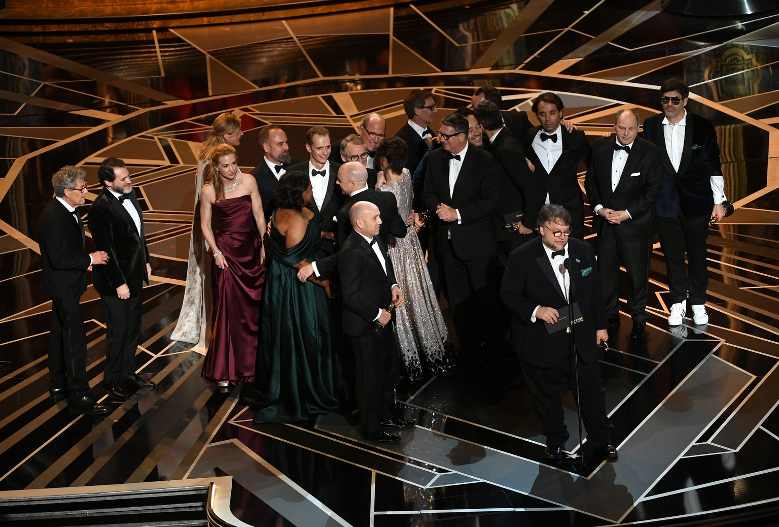  Producer J. Miles Dale (L), director Guillermo del Toro (at microphone) and cast/crew accept Best Picture for 'The Shape of Water' onstage during the 90th Annual Academy Awards. 
