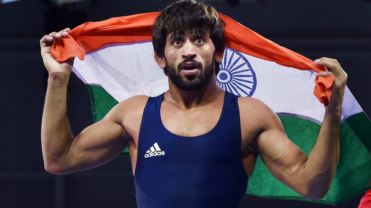   India's Bajrang celebrates after defeating Wales' Kane Charig to win gold in men's freestyle 65 kg wrestling event today. (Image: PTI Photo)  