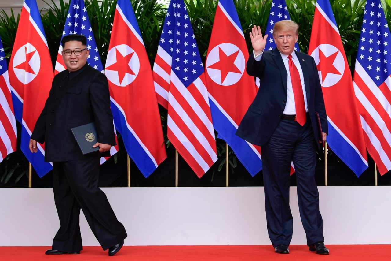  US President Donald Trump waves as North Korea leader Kim Jong Un leaves after their meetings at the Capella resort on Sentosa Island. Image courtesy: AP 