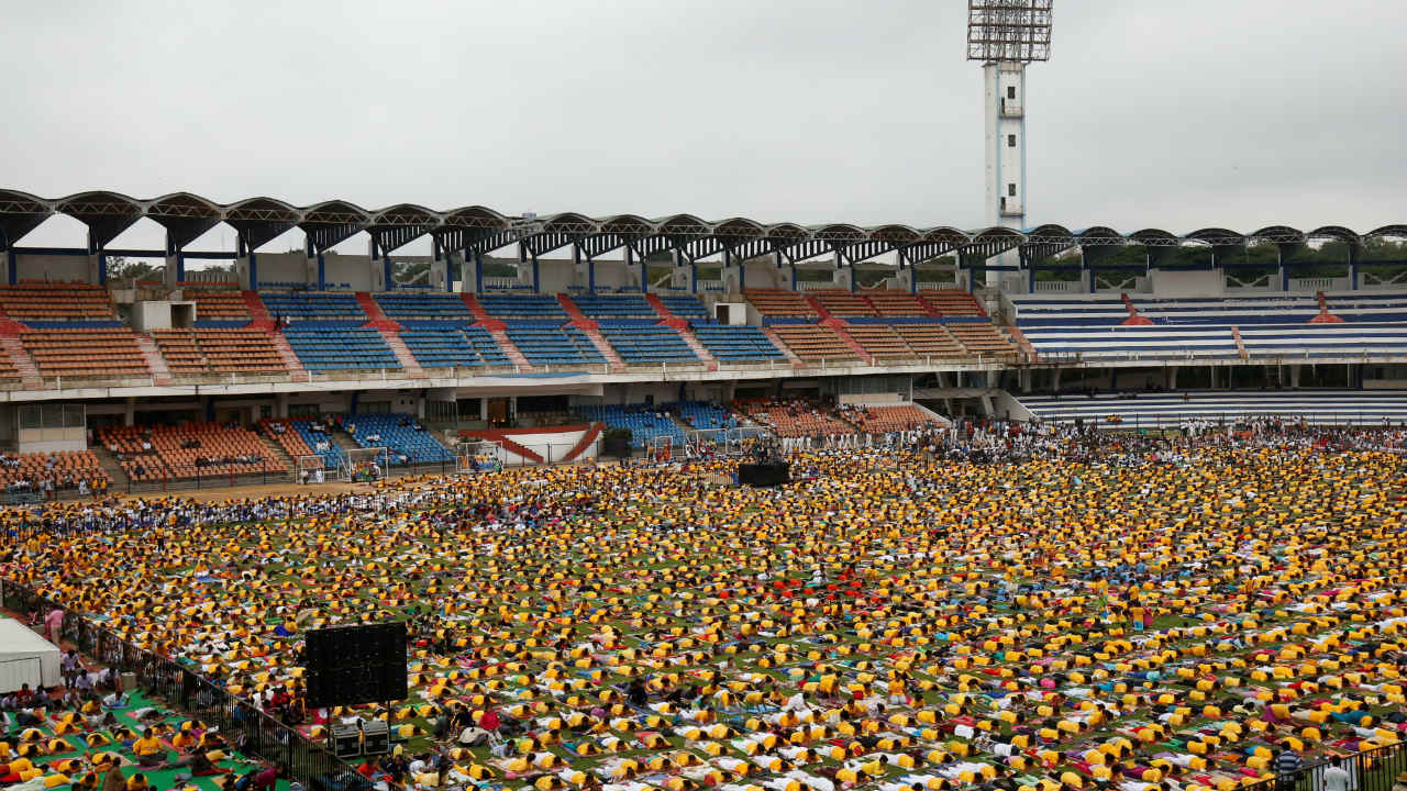  Participants perform yoga at a stadium on International Yoga Day in Bengaluru. (Image: Reuters) 