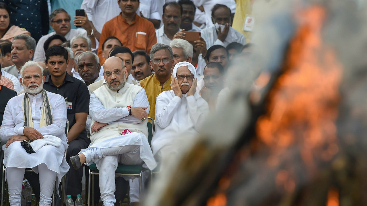 Prime Minister Narendra Modi, BJP President Amit Shah and BJP veteran LK Advani during the cremation of former prime minister Atal Bihari Vajpayee with full state honour, at Rashtriya Smriti Sthal in New Delhi. (Image: PTI) Prime Minister Narendra Modi, BJP President Amit Shah and BJP veteran LK Advani during the cremation of former prime minister Atal Bihari Vajpayee with full state honour, at Rashtriya Smriti Sthal in New Delhi. (Image: PTI)