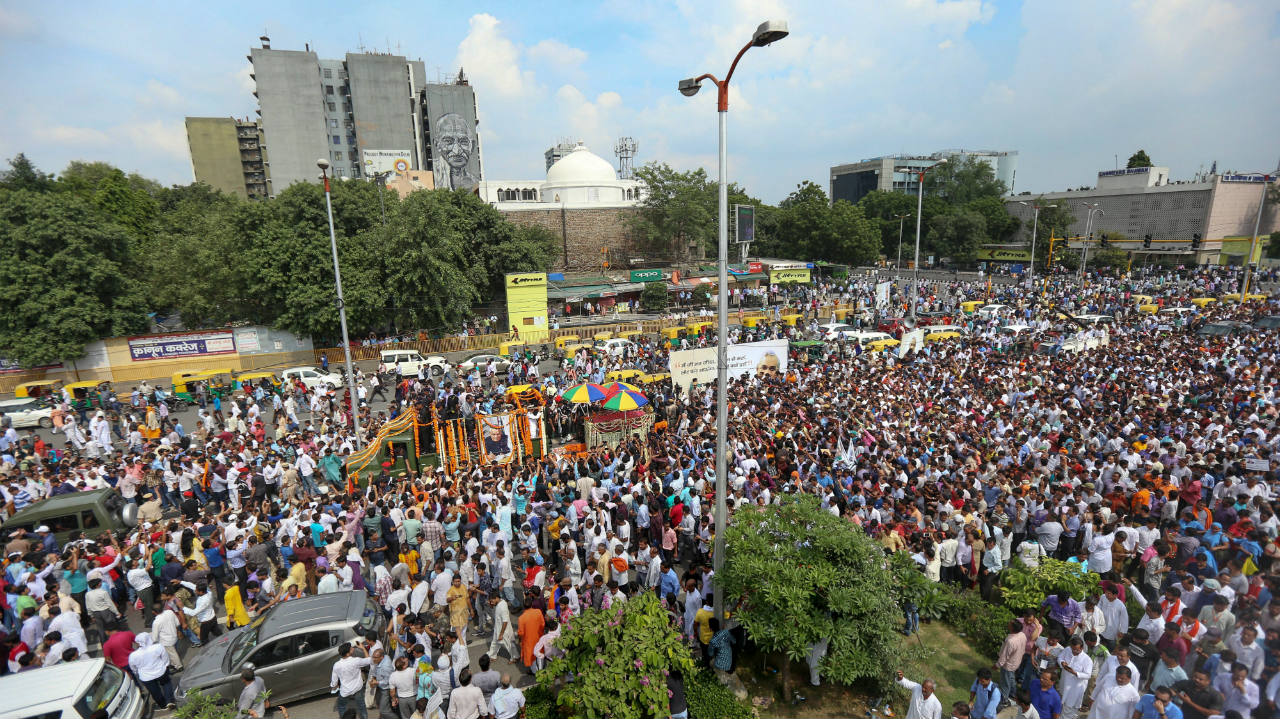   A sea of supporters attended the funeral procession of Atal Bihari Vajpayee as his mortal remains were taken for cremation to Smriti Sthal. (Image: PTI)  