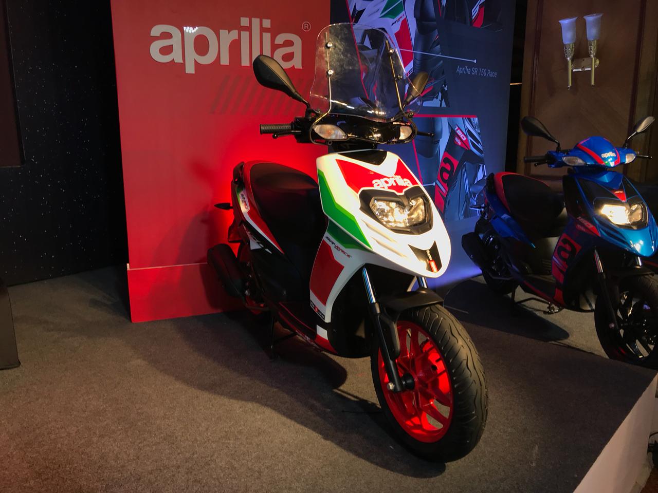<p>The Aprilia&nbsp;SR 150 Race has been launched with a new RS-GP inspired colour&nbsp;scheme. It also gets new 14-inch alloys, adjustable suspension, a windscreen and a 220mm disc brake. Other additions are a digital console and a golden calliper. The Race is priced at Rs 80,211 ex-Pune&nbsp;</p>