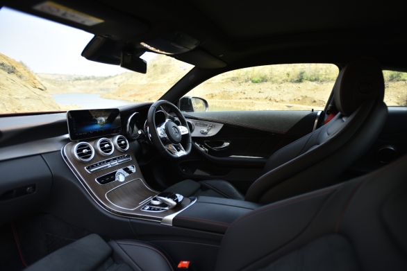 <p>The interior uses more leather and AMG-specific adornments but is derived from the standard C-Class.</p>