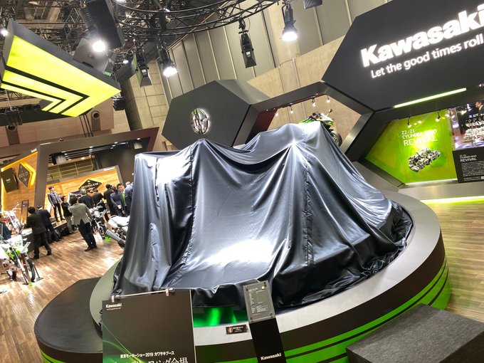 <p>Under this veil are two motorcycles that will set your pulses racing! On the left is the KawasakiZH2 and on the right is the KawasakiZX25R!&nbsp;</p>

<p>The ZH2 is the first production supercharged naked motorcycle and the ZX25R is a 249cc&nbsp;pocket rocket for the track!</p>