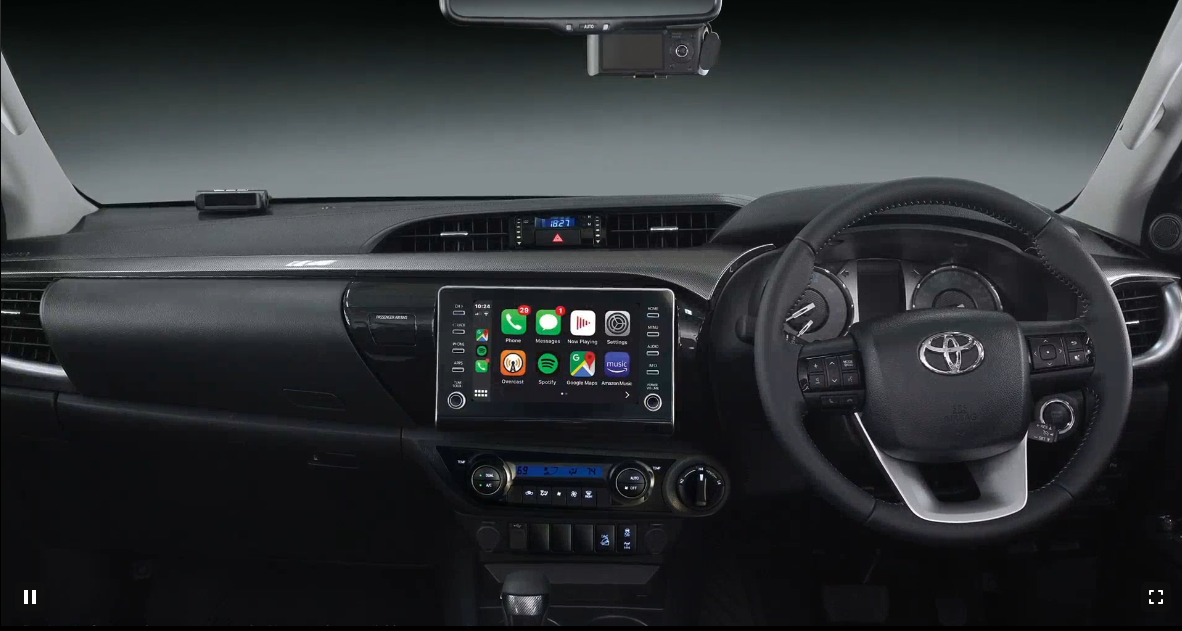 <p>Highlights on the inside of the Toyota Hilux include dual-zone AC, leather upholstery, a Android/AUto/Apple Carplay infotainment and front parking sensor</p>