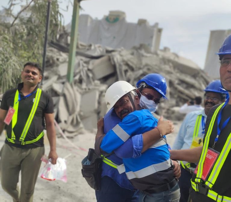 Edifice officials congratulate each other after the "successful demolition" of Supertech twin towers 
  Edifice officials congratulate each other after the "successful demolition" of Supertech twin towers