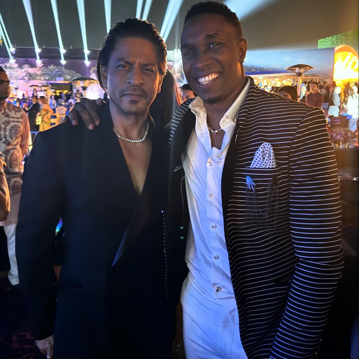 <p><strong>Anant Ambani-Radhika Merchant Wedding LIVE: Dwayne Bravo shares glamorous event moments</strong></p>

<p>Dwayne Bravo gave fans a glimpse of the glitzy affair as he posed alongside Bollywood stalwarts Shah Rukh Khan and Ranveer Singh. Captioned &quot;Wedding vibes! Chilling with the big boys! @iamsrk @ranveersingh Bollywood meets Cricket...#SirChampion,&quot; the post captured the fusion of two worlds. Shah Rukh Khan donned a sharp black suit, accessorized with a dazzling diamond necklace, while Ranveer Singh opted for an all-white ensemble, adding to the evening&#39;s star-studded charm.</p>

