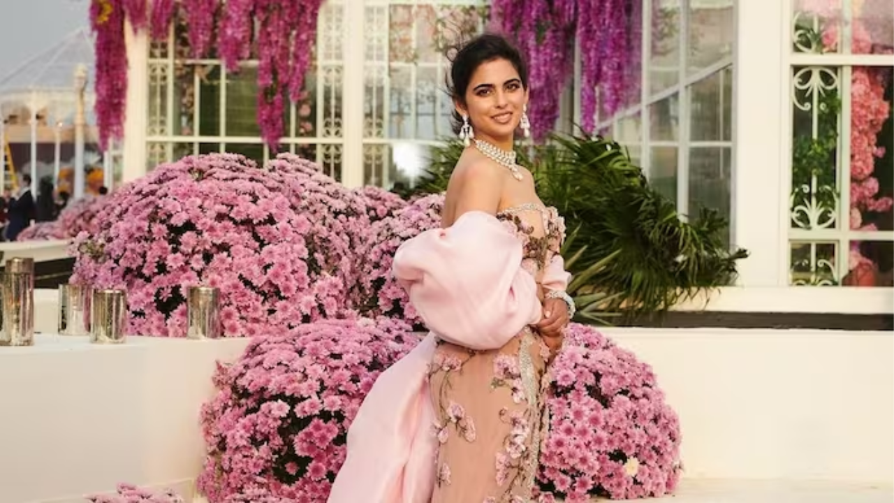 <p><strong>Anant Ambani-Radhika Merchant Wedding LIVE: Isha Ambani choses a soft pink ensemble</strong></p>

<p>Isha Ambani set the tone for her brother Anant&#39;s pre-wedding celebrations with her stunning appearance. She graced the event in a mesmerizing soft pink off-the-shoulder gown, meticulously crafted by London-based designer Miss Sohee. The gown boasted delicate floral motifs, lending an air of sophistication to Isha&#39;s ensemble. A flowing satin train added a touch of drama and grandeur, making Isha&#39;s first official look for the three-day festivities truly unforgettable.</p>

